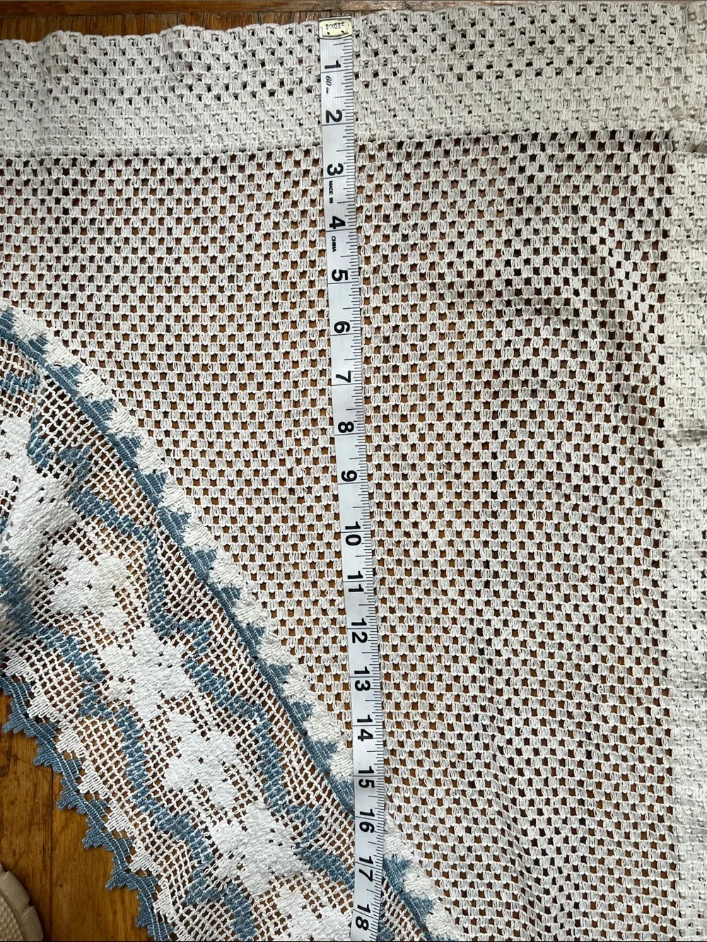 Set of curtain swags with Blue Trim.